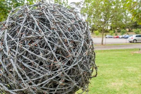 Barb wire rolled up into a ball shaped ornament Stock Photos