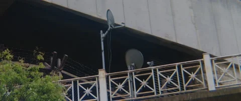 Barb Wire Security Gate Satellite Dish Video stock 238469187