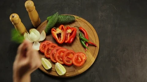 Barbecue and vegetables on a black table Top. Slide. Slow motion Stock Footage 81713194