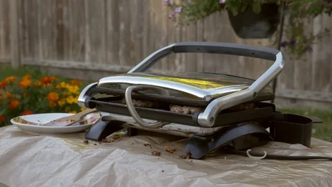 Barbecue with burgers inside. Stock-Footage 77283524