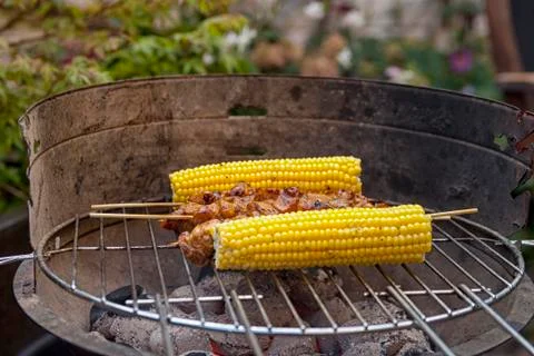 Barbecue with corn and satay Foto stock