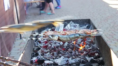 Barbecue fish, meat and vegetables roast on the grill.Street Food, Fast Food Stock Footage
