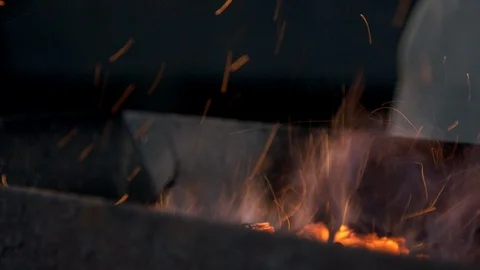 Barbecue flaring up process with sparkles Stock Footage 121364048