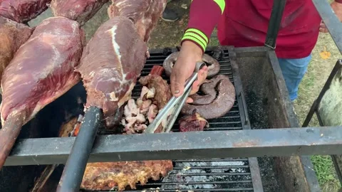 Barbecue on grill  black pudding, blood sausage, sausages,corn. Stock Footage 322092322