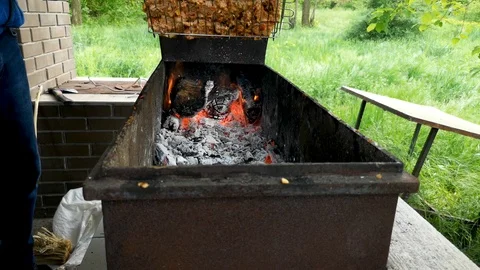 Barbecue grill. Close-up. Sometimes a man turns the meat on the grill. The conce Stock Footage 110575570