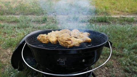 Barbecue grill. Close-up. Sometimes a man turns the meat on the grill. The conce Stock Footage 111021843