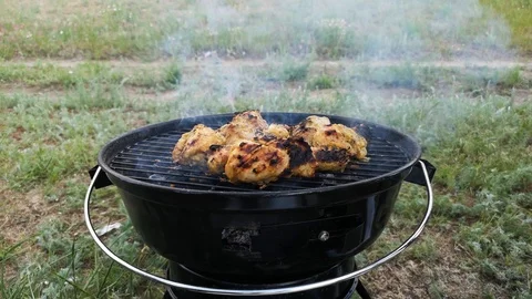 Barbecue grill. Close-up. Sometimes a man turns the meat on the grill. The conce Stock Footage 111021861