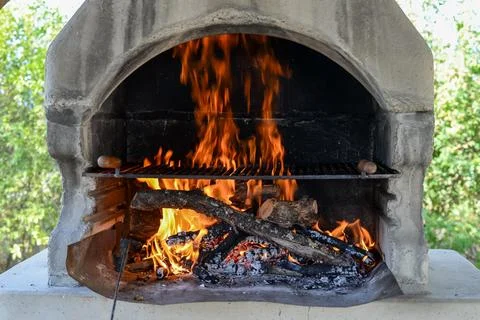 Barbecue grill with fire flames - Empty fire grid Stock Photos