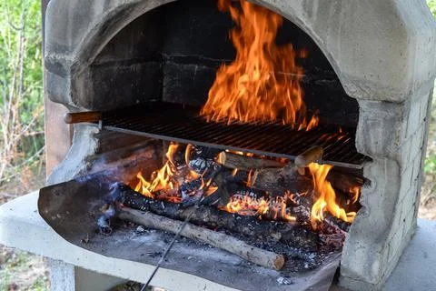 Barbecue grill with fire flames - Empty fire grid Stock Photos