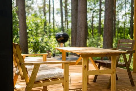 Barbecue grill in front of idyllic backyard. Outdoor party on the holiday cam Stock Photos