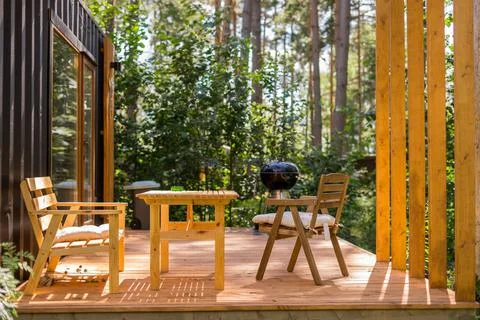 Barbecue grill in front of idyllic backyard. Outdoor party on the holiday cam Stock Photos