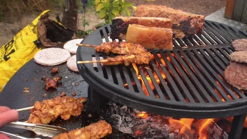 Barbecue Livar pork chicken kebab turning the meat Stock Footage
