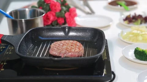 Barbecue meat on grill Stock Footage 314908666