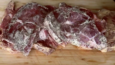 Barbecue Meat From Package On A Cutting Board, Preparation For Grilling Close Up Stock Footage 240933983
