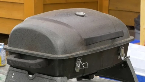Barbecue opening and checking. Stock-Footage 77579736