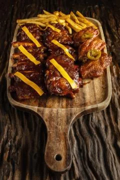 Barbecue pork ribs and chicken wings with french fried and cheese Stock Photos