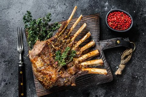 Barbecue rack of lamb meat chops. Black background. Top view Stock Photos