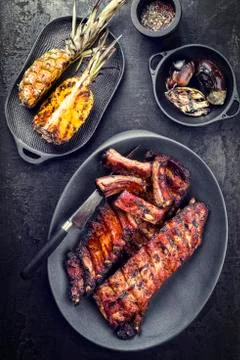 Barbecue spare ribs St Louis cut hot honey chili marinade with pineapples and Stock Photos