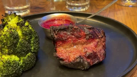 Barbecue steak and broccoli Grilled pork steak with broccoli and tomatoes on Stock Footage 325813447