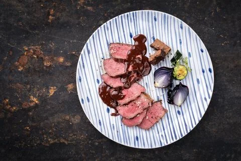 Barbecue wagyu dry aged fillet steak slices with brownie and chili chocolate  Stock Photos