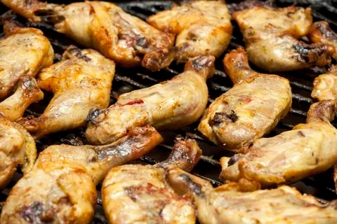 Barbecued drumsticks Stock Photos