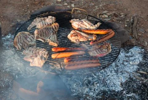 Barbecued meat and sausages. bush camping. flinders ranges. south australia. Stock Photos