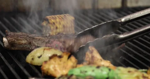 Barbecued meat and vegetables Stock Footage 142557491