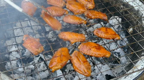 Barbecuing chicken wing Stock Footage 63654436
