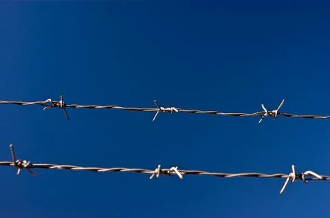 Barbed wire against sky Stock Photos
