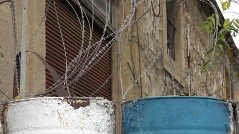 Barbed-wire and barrels marking United Nations Buffer Zone Nicosia Stock Footage 230413652