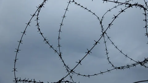 Barbed wire and the cloudy sky, 4K Stock Footage 101773348
