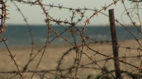Barbed Wire and the Ocean Stock Footage 134111