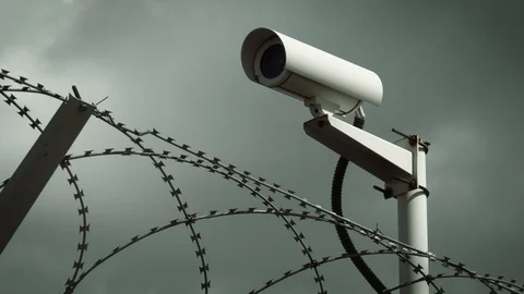 Barbed wire and surveillance camera Stock Footage