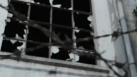 Barbed wire on background of destroyed building. concept of war and withdrawal Stock Footage 222432275