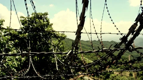 Barbed wire blocking beautiful nature. Stock Footage 39838020