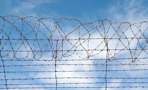 Barbed wire blue sky Stock Photos