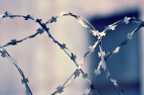 Barbed wire on blurred abstract background Stock Photos