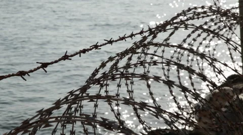 Barbed Wire - Borders, frontiers by the sea. Video stock 58604765