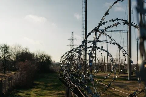 Barbed wire close-up. Conclusion, restriction of freedom. Stock Photos