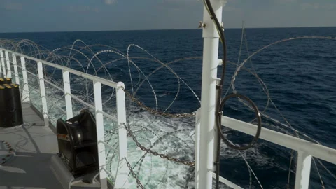 Barbed wire on deck of ship. Protection from pirates. Open deck in barbed wire Stock Footage 244591665