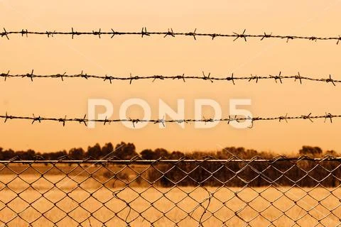 Barbed wire detention center at countryside and background sepia color style Stock Photos