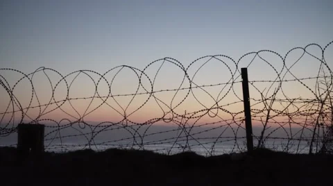 Barbed wire fence blocking access to the beach, Beirut Stock Footage 68821810