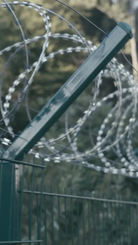 Barbed wire fence border security barrier Stock Footage 324967857