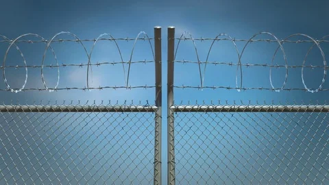 Barbed wire fence gate opens. Blue sky in the background. Includes alpha channel Stock Footage 78865137