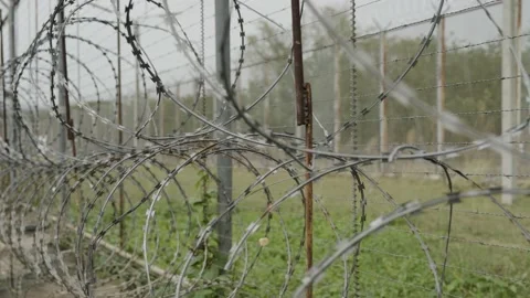 Barbed Wire Fence, High Security Razor Wire Fence, Protecting Jail Time Video stock 236392550