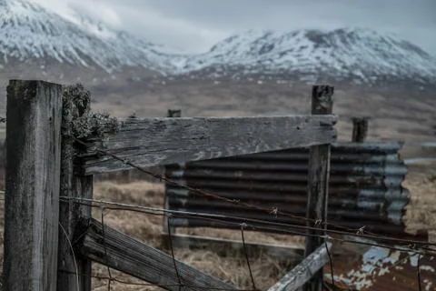 Barbed wire fence in the highlands Stock Photos