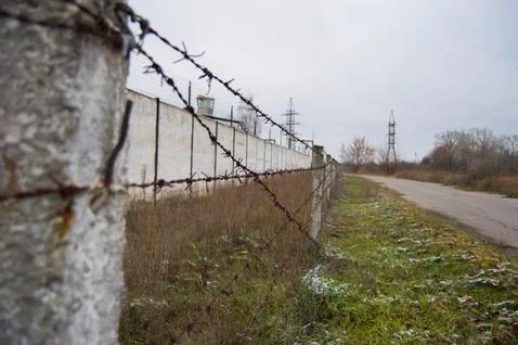 Barbed wire fence, maximum security prison Stock Photos