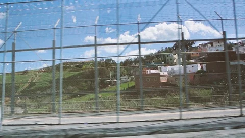 Barbed wire fence at Moroccan border migrant protection Stock Footage 108274363