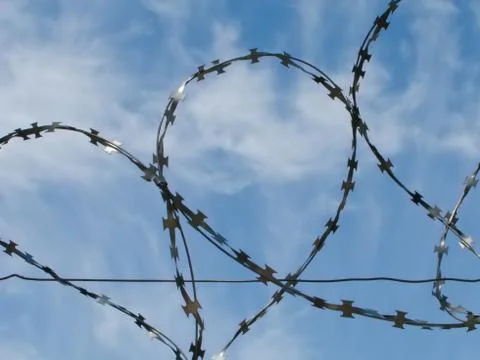 Barbed wire fence Stock Photos