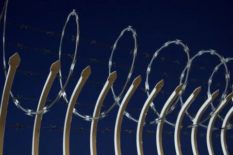 Barbed wire fence Stock Photos